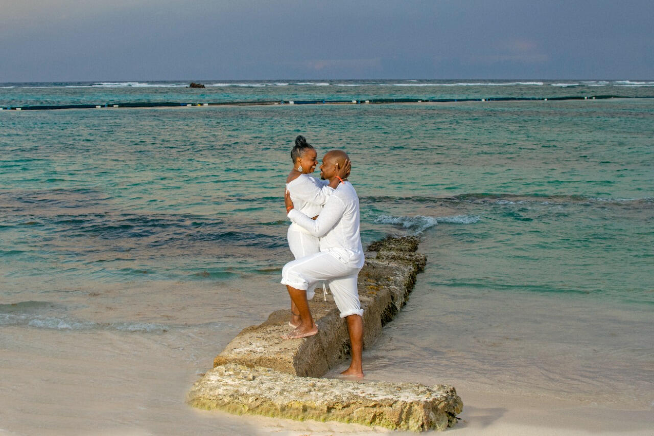 Silhouette of couple embracing at sunset
